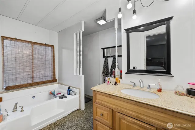 a bathroom with a sink double vanity and a mirror