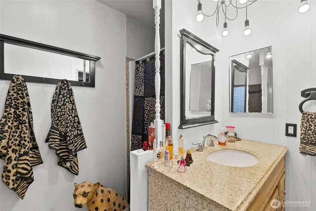 a view of walk in closet with clothes