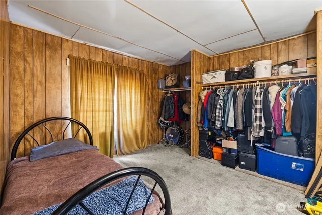a view of a storage and utility room with closet