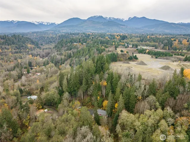 a view of a house with backyard porch and sitting area