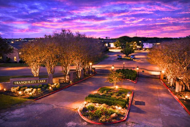 a view of a swimming pool with a yard