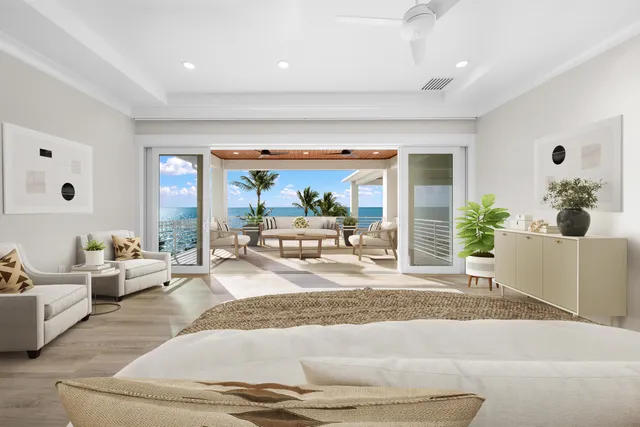 a bedroom with furniture and a large window