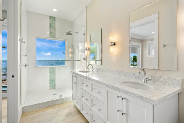 a spacious bedroom with a bed a couch and a potted plant