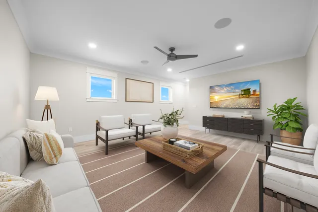 a view of a hallway and a livingroom with furniture