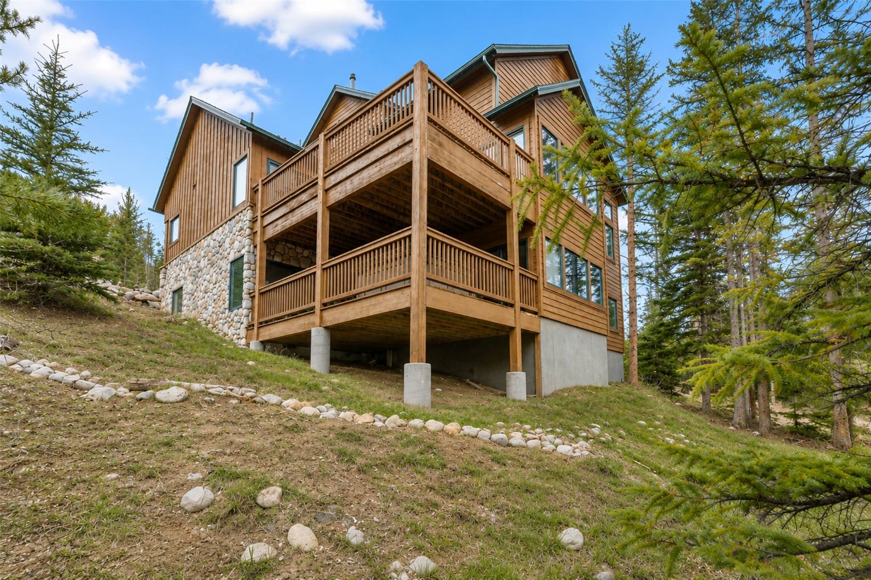 91795 Ryan Gulch Road Silverthorne, CO 80498 - Photo 49 of 50 a view of a house with a yard