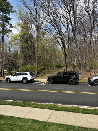 a view of street with parked cars