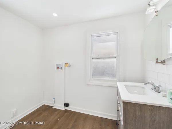 a bathroom with a sink and vanity
