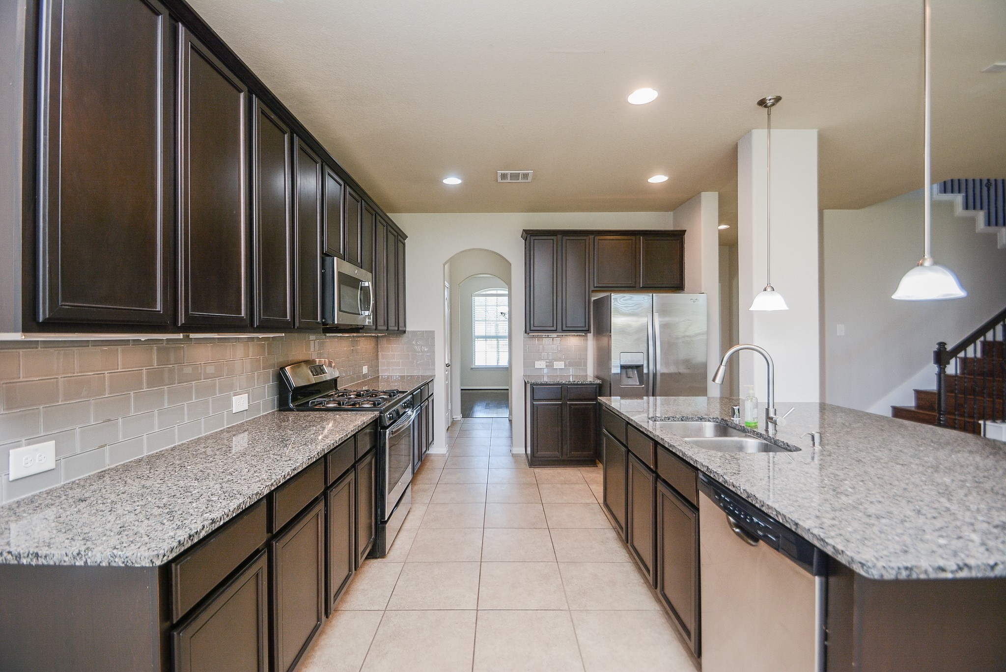 7418 Wilson Reach Lane Spring, TX 77389 - Photo 11 of 32 Kitchen with granite countertop ang lots of storage.