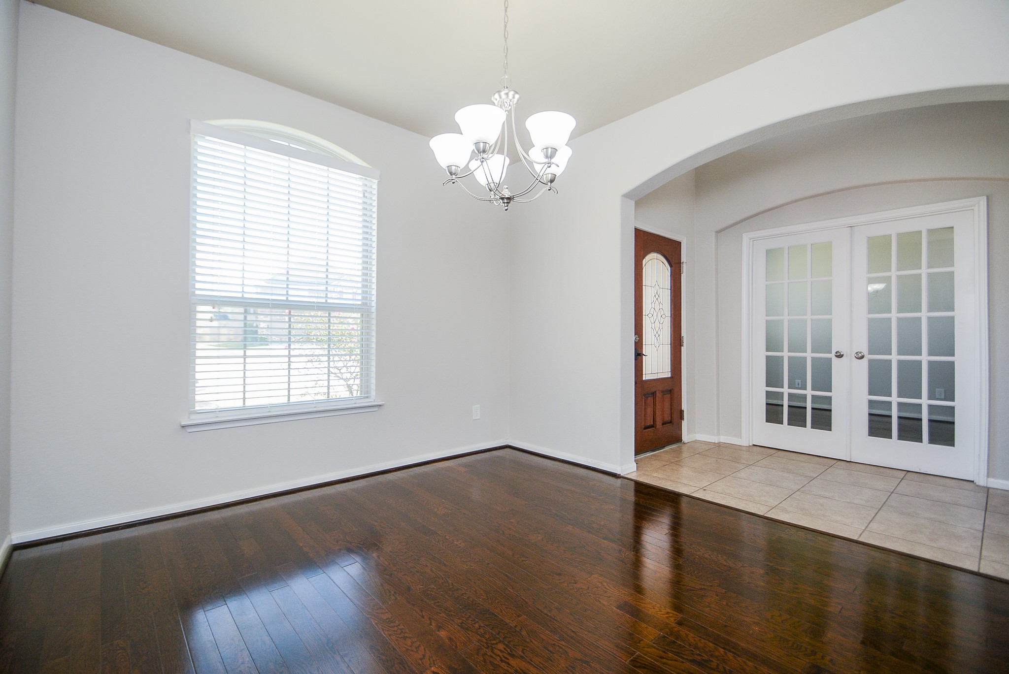 7418 Wilson Reach Lane Spring, TX 77389 - Photo 4 of 32 Formal Dining with a beautiful chandelier and high ceiling.