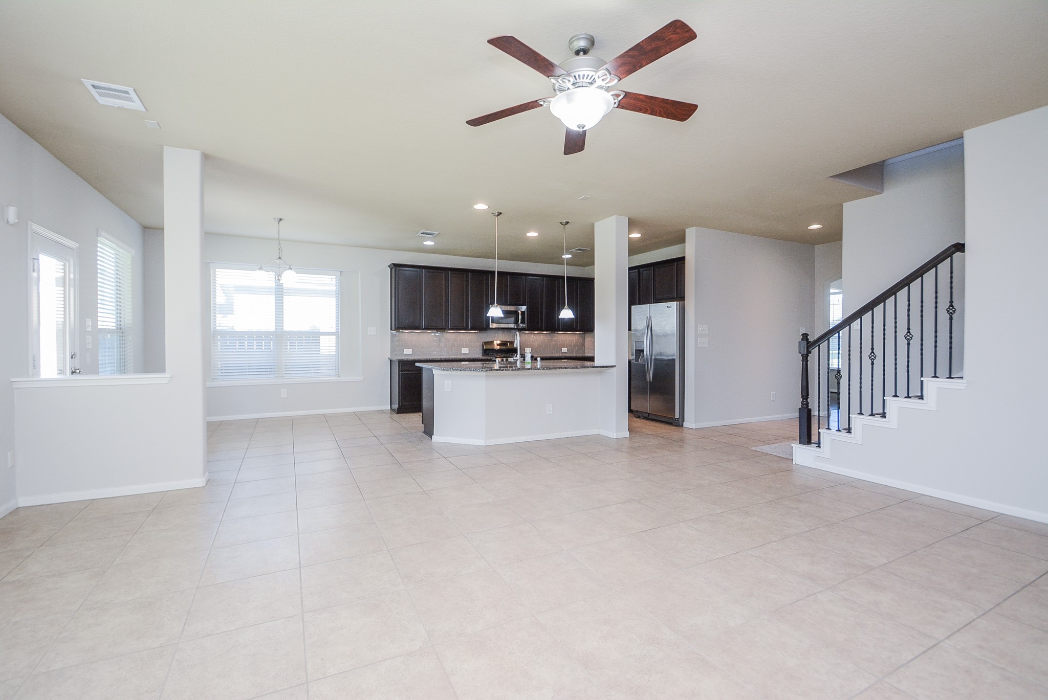 7418 Wilson Reach Lane Spring, TX 77389 - Photo 32 of 32 An open floor plan from the living room to the kitchen for an easy conversation.
