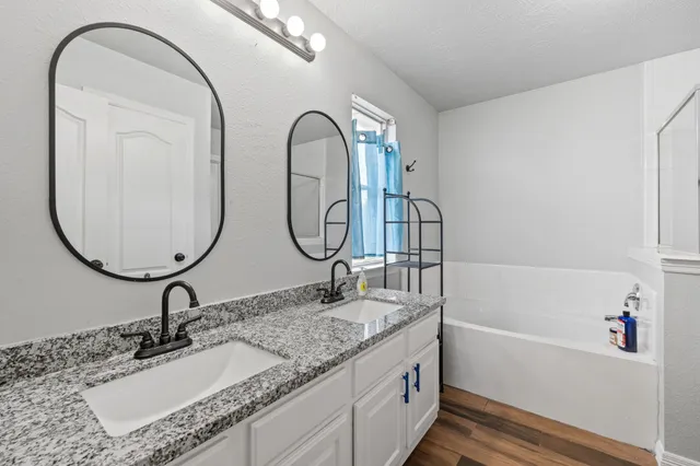 a bathroom with a sink and a mirror