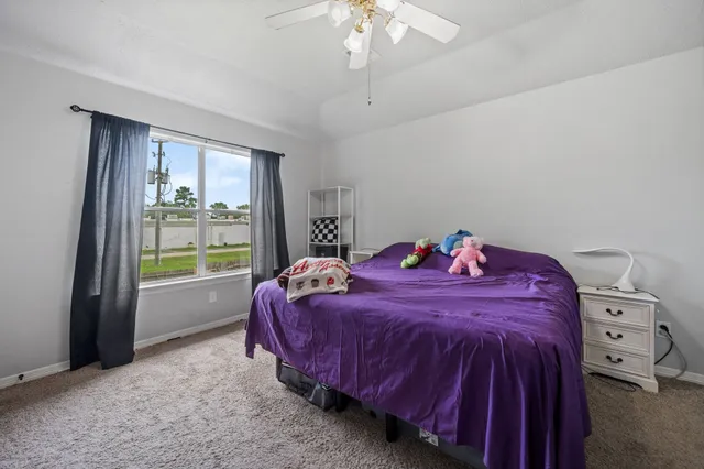 a bed room with a bed and a window