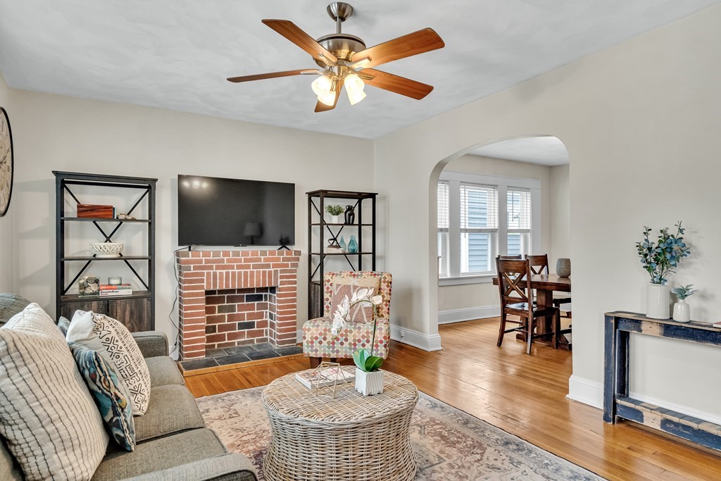 a living room with furniture fireplace and a flat screen tv