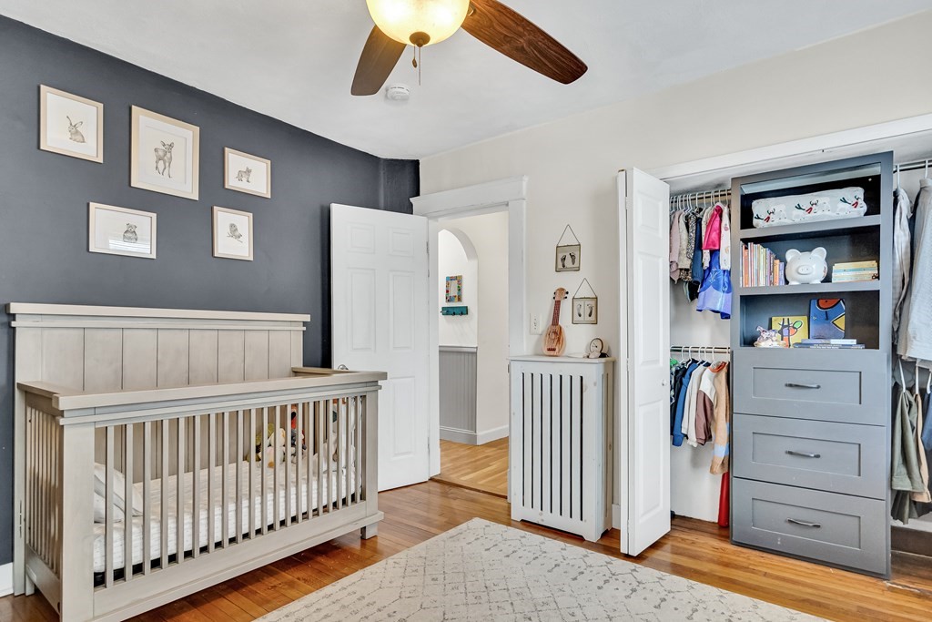 63-65 Brookley Road, Unit 1 Boston, MA 02130 - Photo 15 of 20 a bedroom with furniture and baby crib