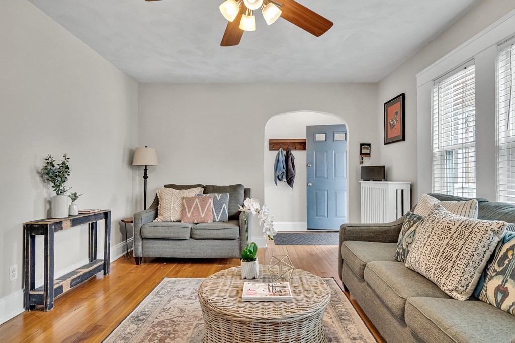 63-65 Brookley Road, Unit 1 Boston, MA 02130 - Photo 3 of 20 a living room with furniture and a chandelier