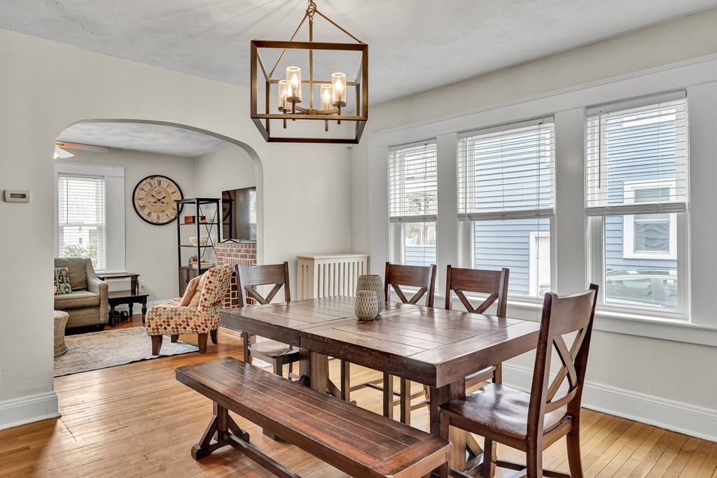 63-65 Brookley Road, Unit 1 Boston, MA 02130 - Photo 6 of 20 a view of a dining room with furniture window and wooden floor