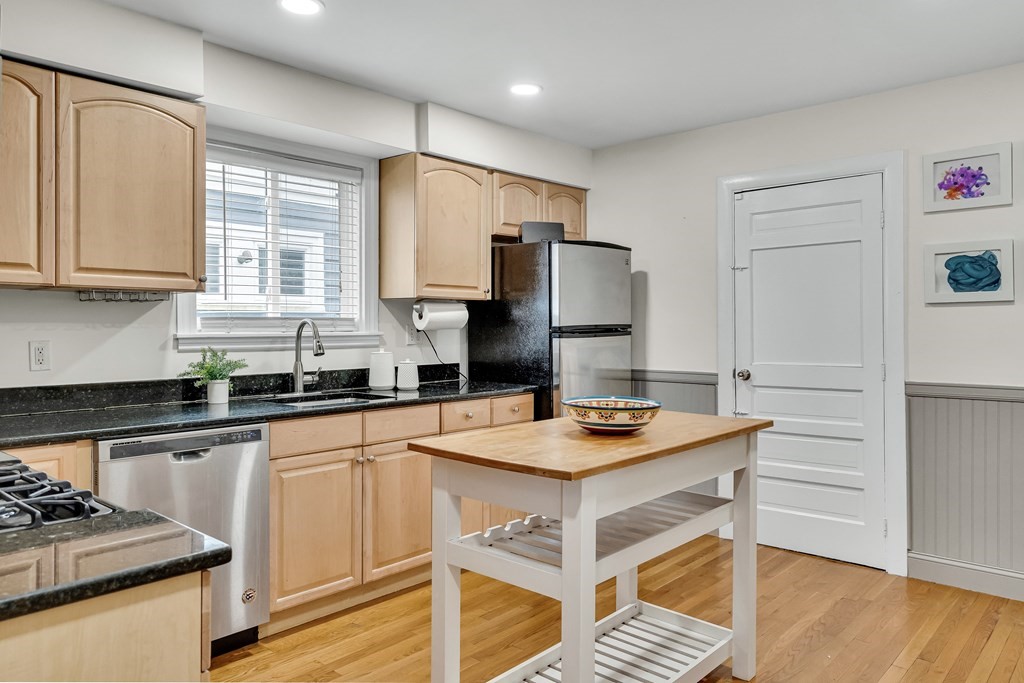 63-65 Brookley Road, Unit 1 Boston, MA 02130 - Photo 7 of 20 a kitchen with a sink stove and refrigerator