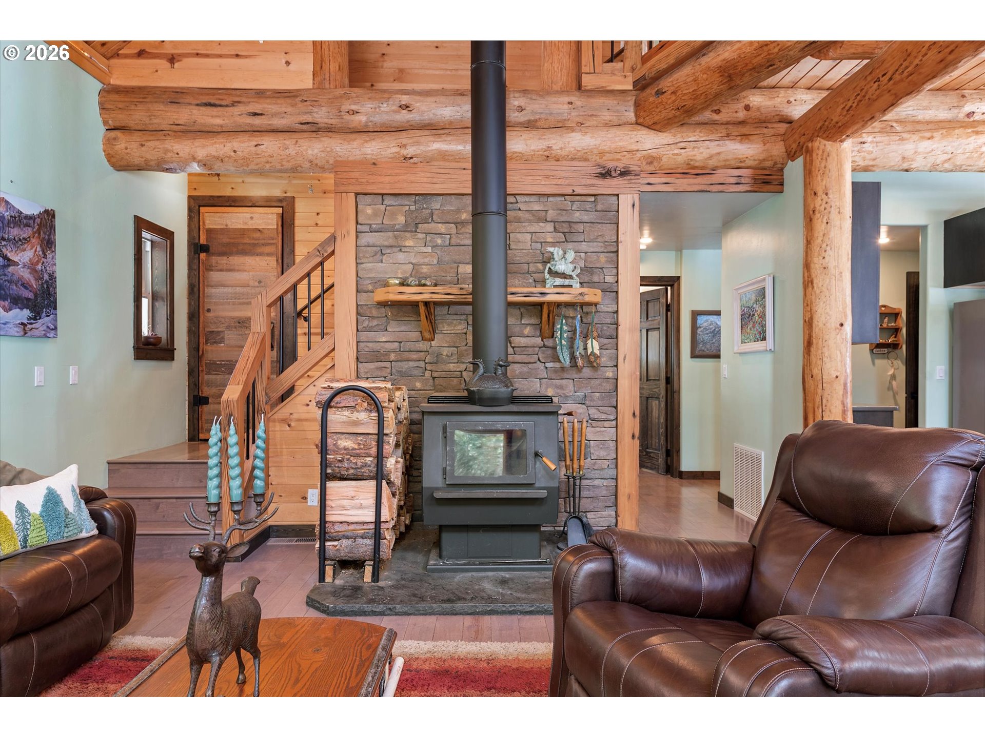 60989 Old Ski Run Road Joseph, OR 97846 - Photo 13 of 46 a living room with furniture a fireplace and a flat screen tv