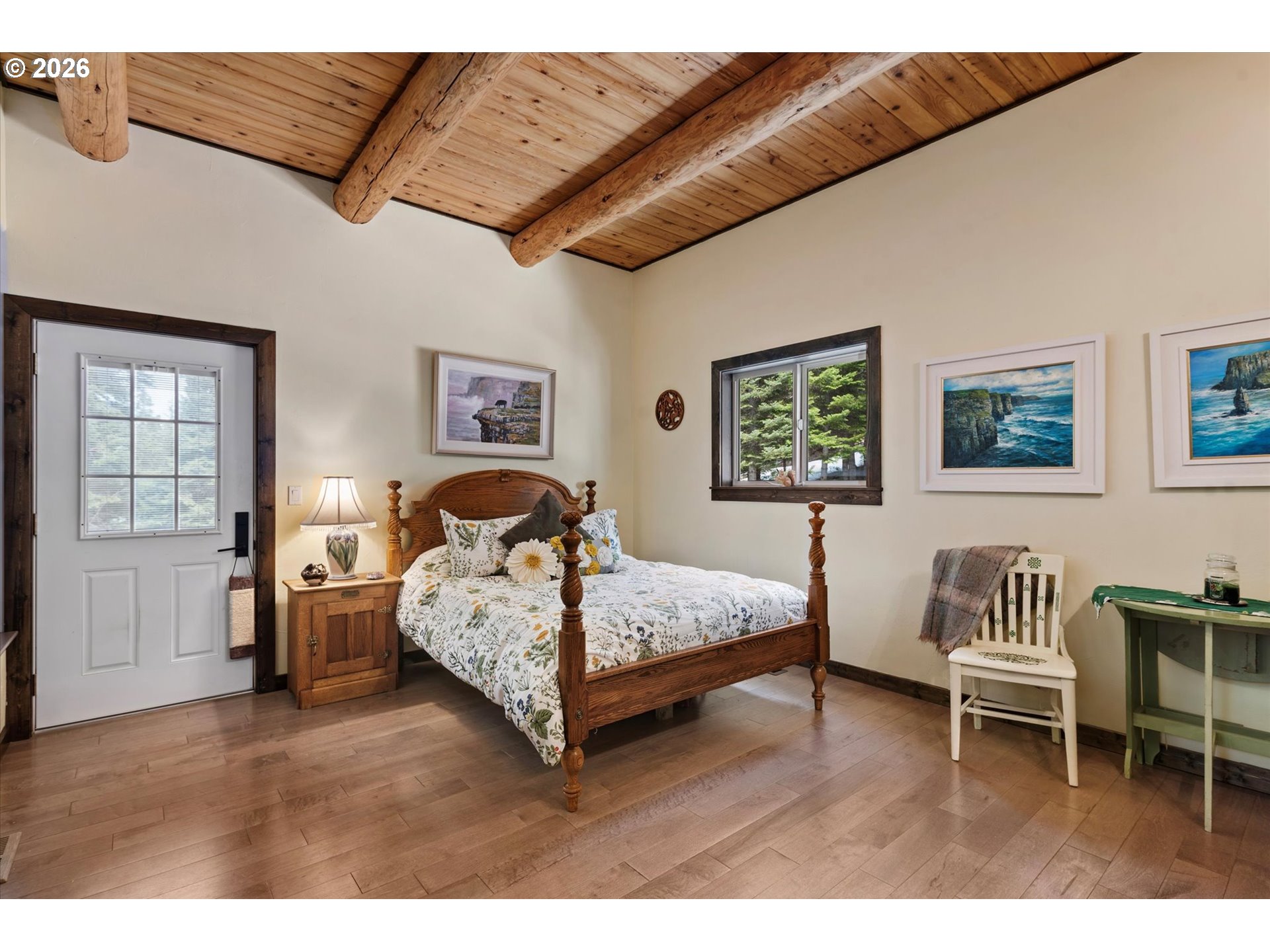 60989 Old Ski Run Road Joseph, OR 97846 - Photo 14 of 46 a bedroom with a bed and a chair