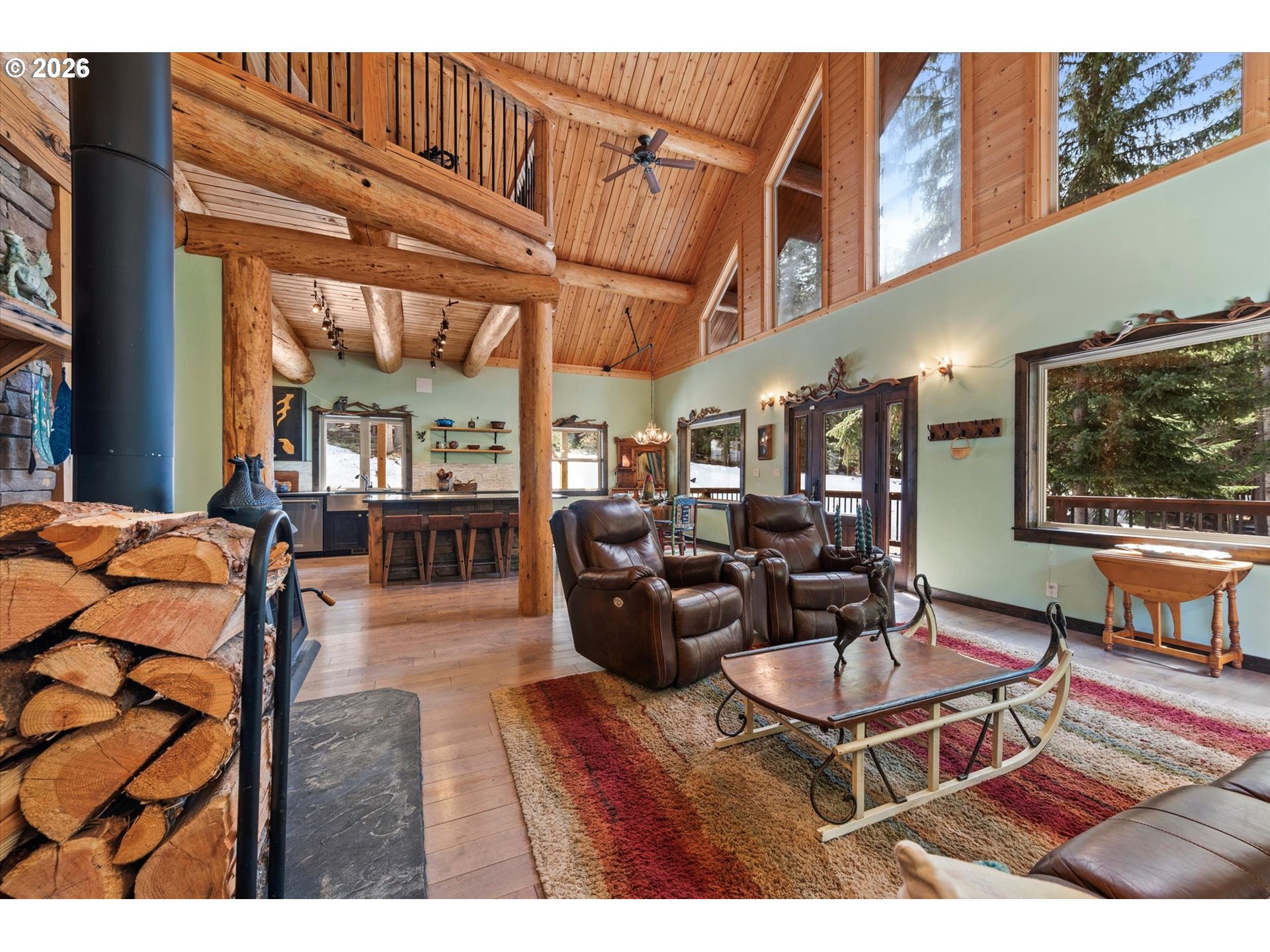 60989 Old Ski Run Road Joseph, OR 97846 - Photo 21 of 46 a living room with lots of furniture and a flat screen tv