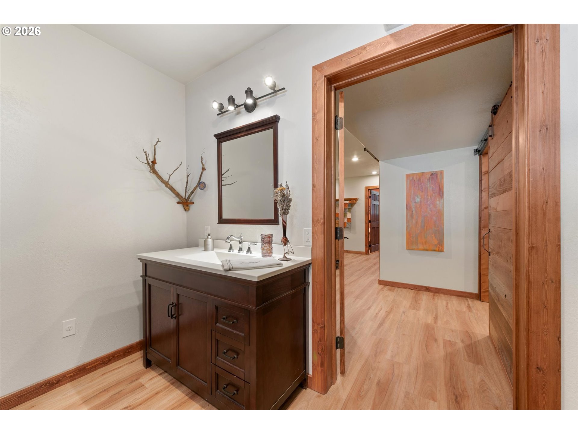 60989 Old Ski Run Road Joseph, OR 97846 - Photo 33 of 46 a bathroom with a sink a mirror and a shower