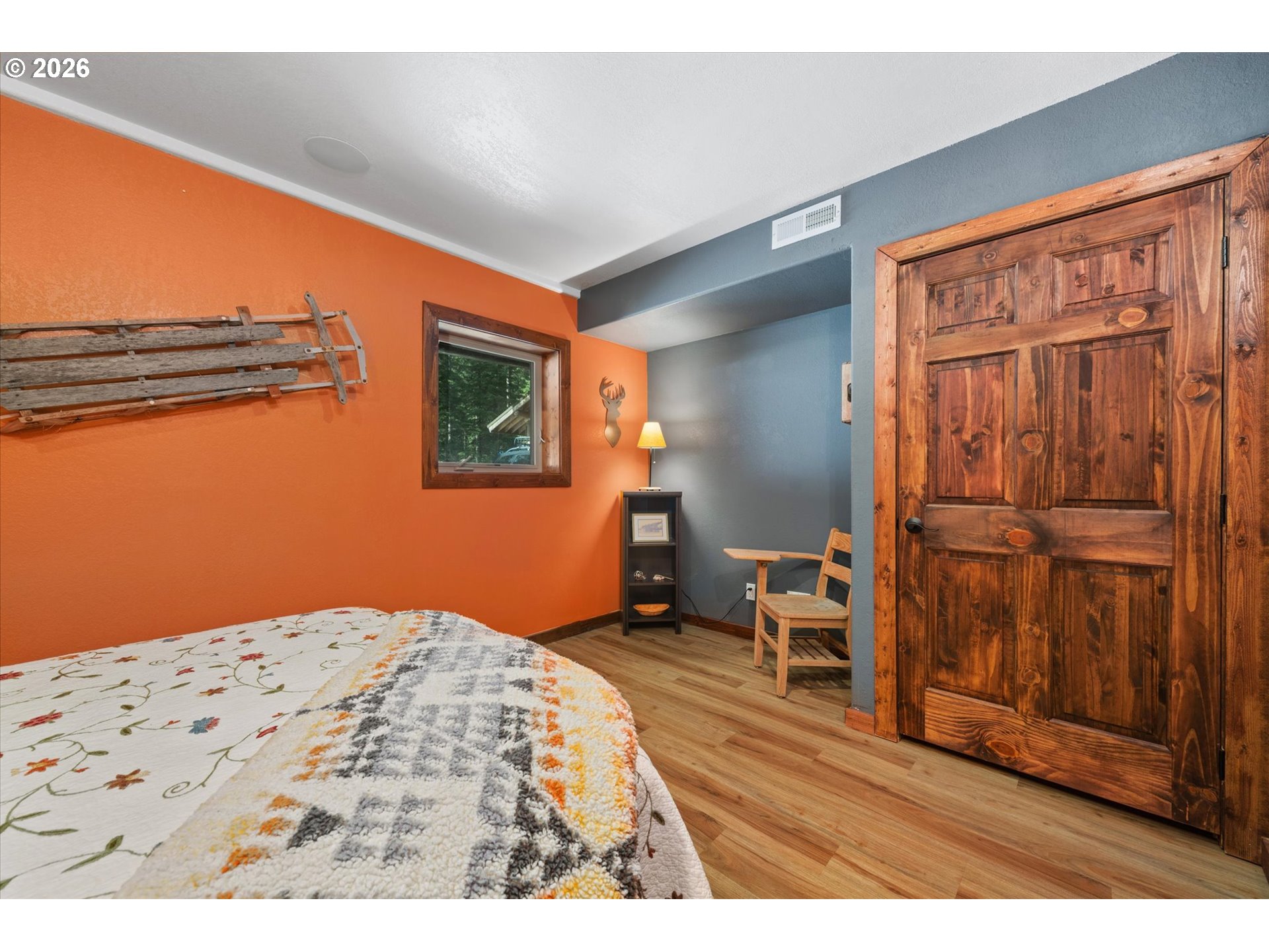 60989 Old Ski Run Road Joseph, OR 97846 - Photo 36 of 46 a bedroom with a bed and wooden floor