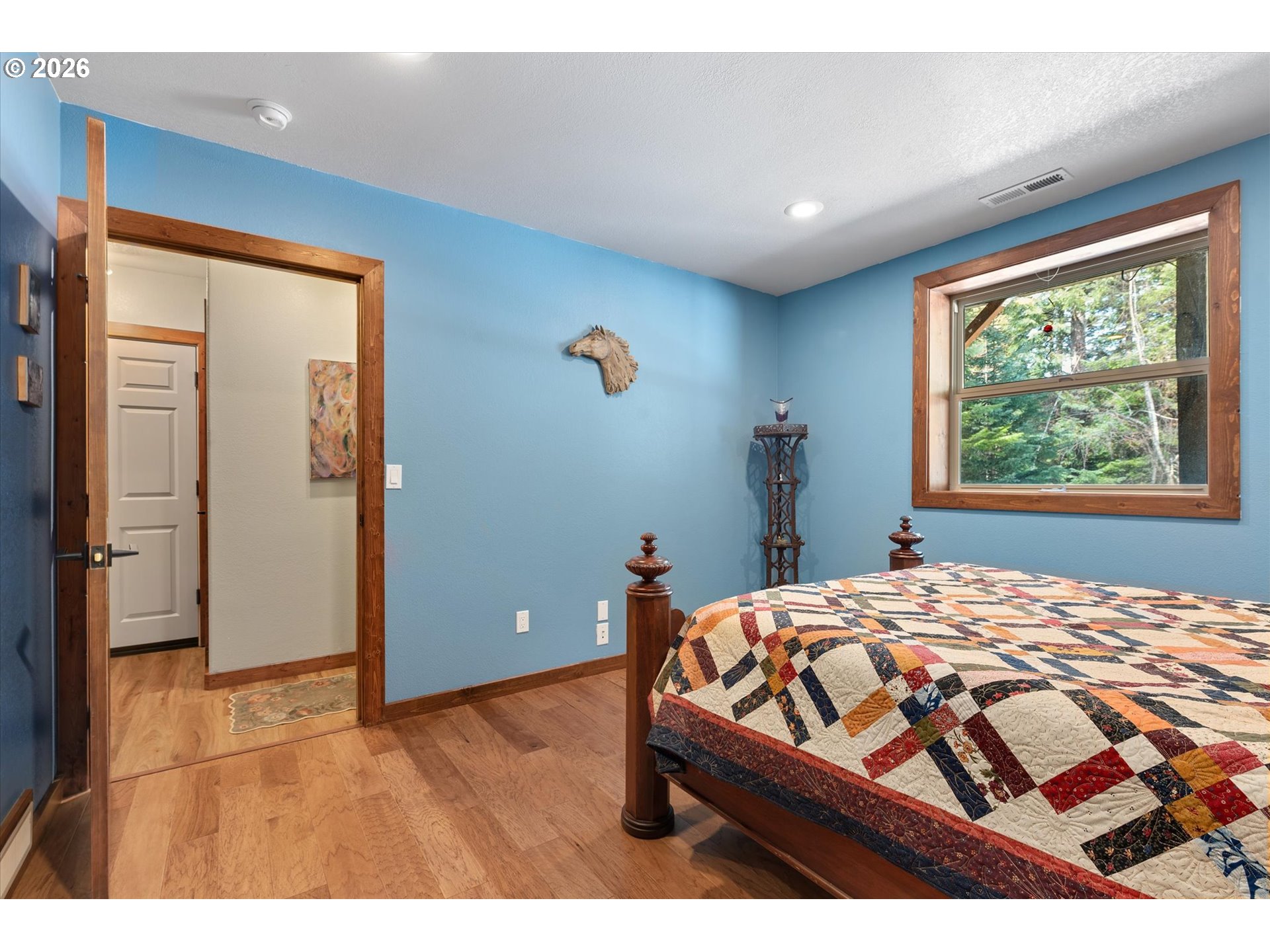 60989 Old Ski Run Road Joseph, OR 97846 - Photo 38 of 46 a bedroom with a bed and wooden floor