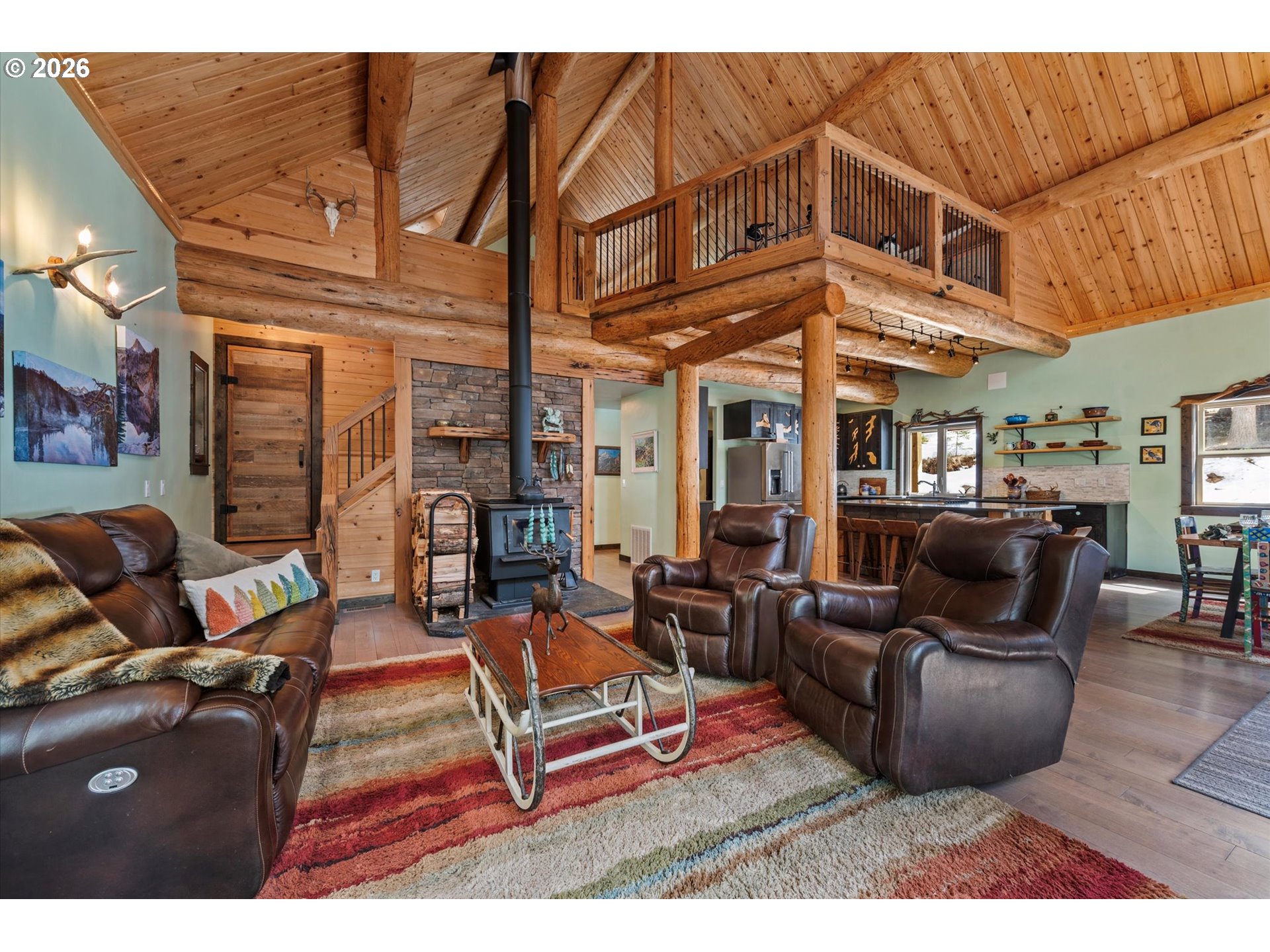 60989 Old Ski Run Road Joseph, OR 97846 - Photo 4 of 46 a living room with fireplace furniture and a rug