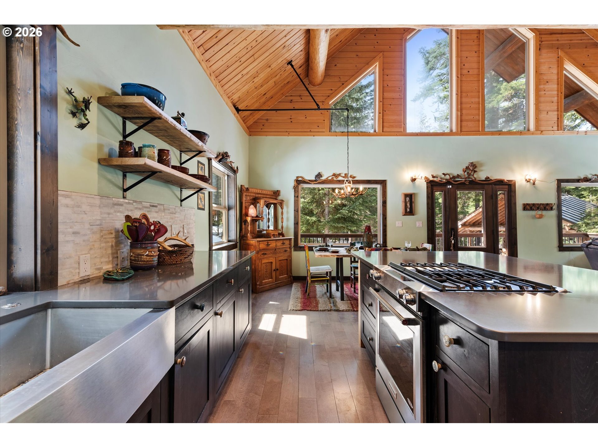 60989 Old Ski Run Road Joseph, OR 97846 - Photo 7 of 46 a kitchen that has a lot of cabinets in it