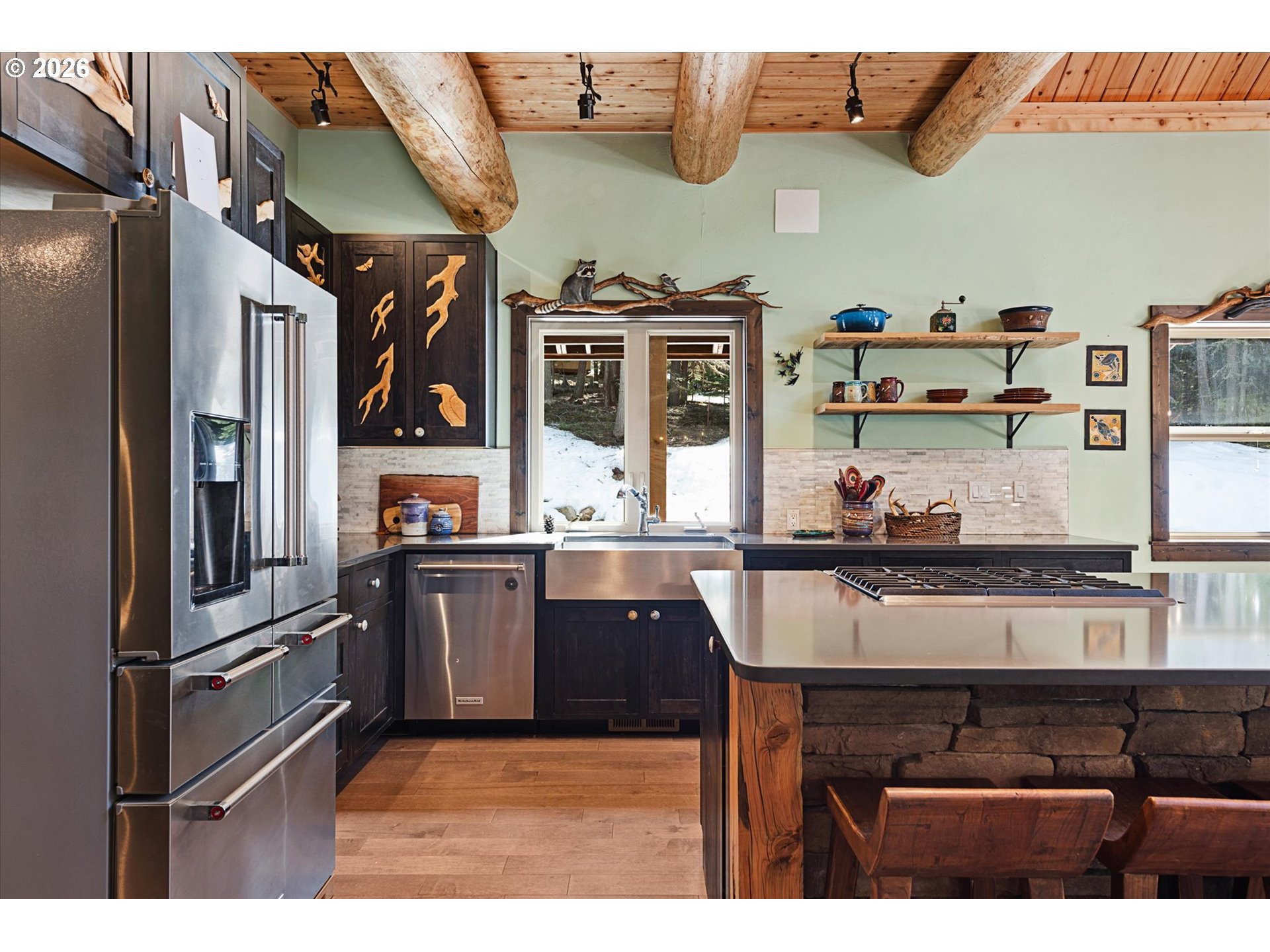 60989 Old Ski Run Road Joseph, OR 97846 - Photo 8 of 46 a kitchen with stainless steel appliances granite countertop a stove and a sink
