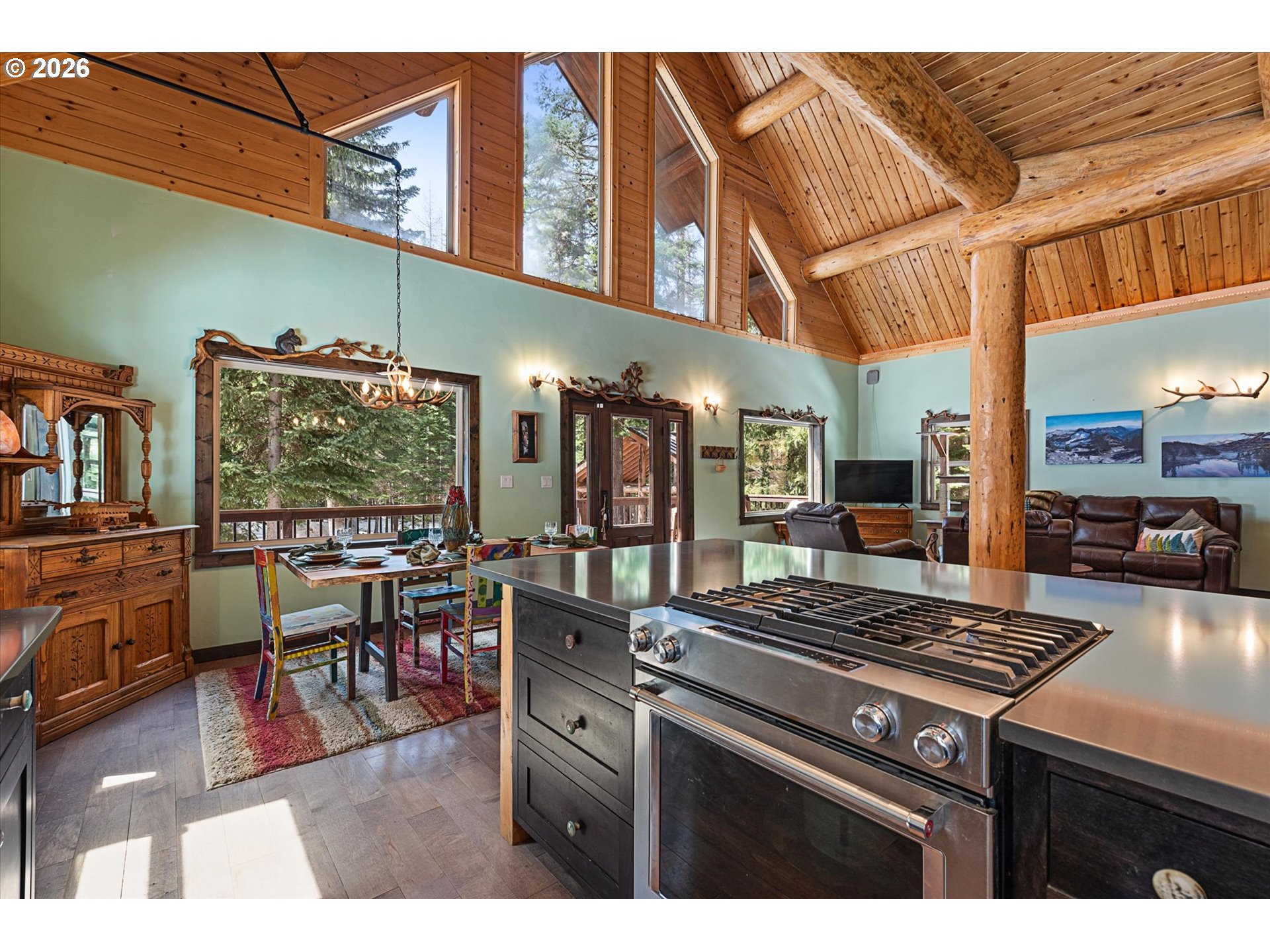 60989 Old Ski Run Road Joseph, OR 97846 - Photo 9 of 46 a kitchen with a stove and a wooden floor