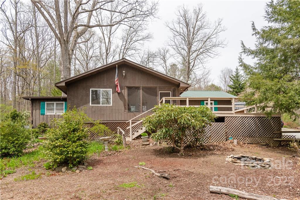 242 Colony Road Hendersonville, NC 28792 - Photo 1 of 14 a front view of a house with garden