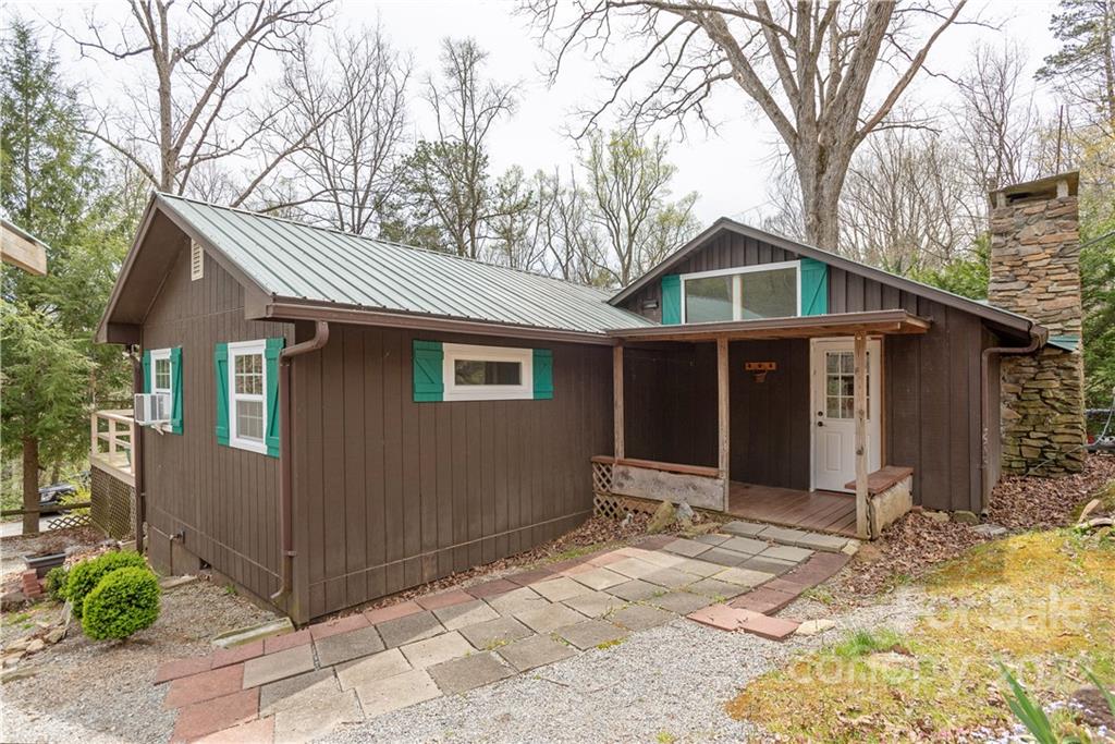 242 Colony Road Hendersonville, NC 28792 - Photo 2 of 14 a front view of a house with a yard