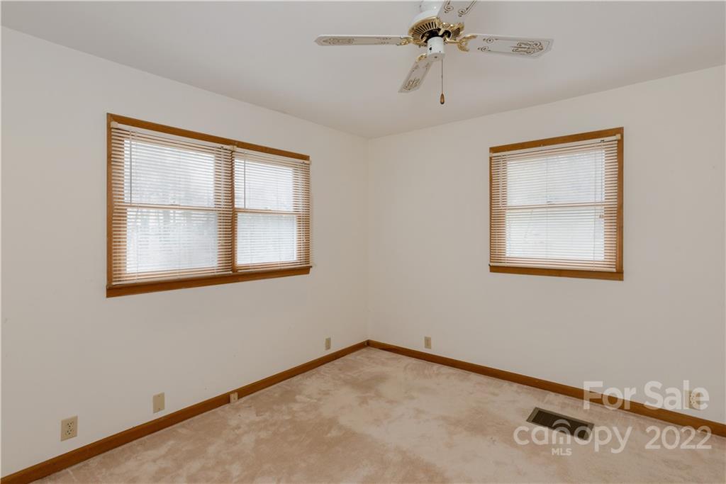 242 Colony Road Hendersonville, NC 28792 - Photo 3 of 14 a view of an empty room with a window
