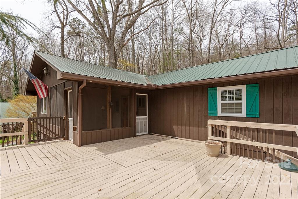 242 Colony Road Hendersonville, NC 28792 - Photo 5 of 14 a house view with a deck