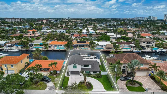 an aerial view of a house with a lake view