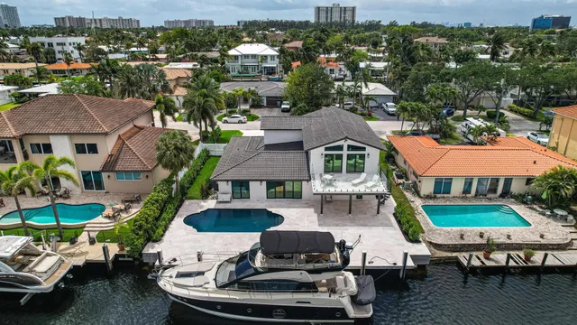 an aerial view of a house with a ocean view