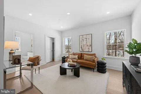 a large spacious bathroom with a bathtub and large window