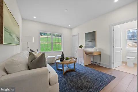 a living room with furniture rug and window