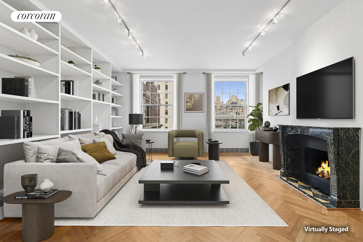a living room with furniture and a fireplace