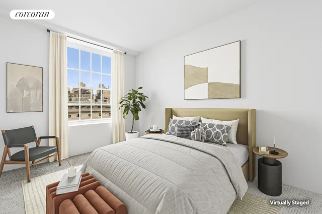 a bedroom with a bed and a potted plant