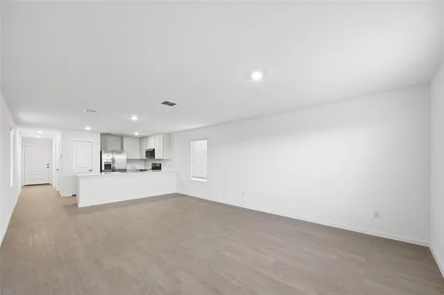 a view of a kitchen with a sink and a window