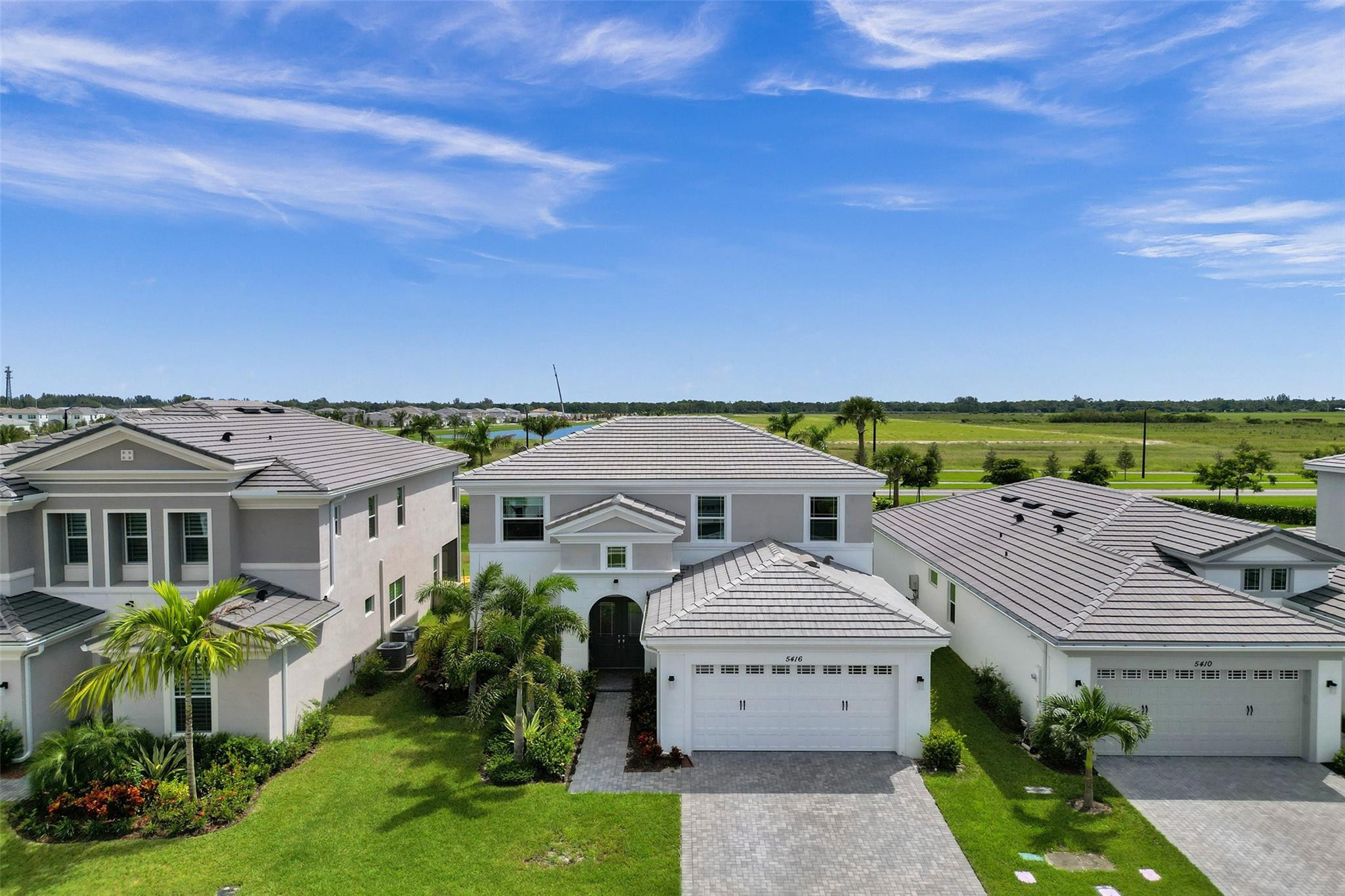 5416 Macoon Way Loxahatchee, FL 33470 - Photo 1 of 43 a front view of a house with a yard