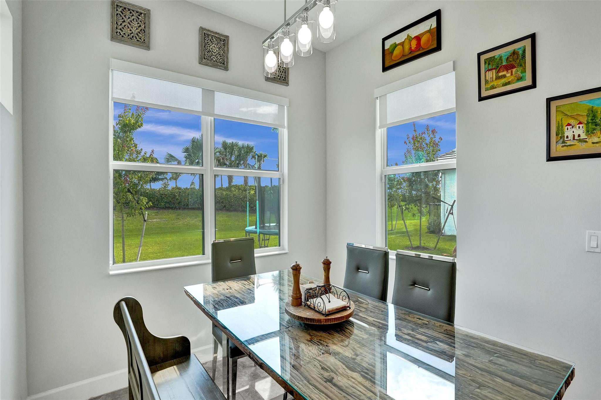 5416 Macoon Way Loxahatchee, FL 33470 - Photo 12 of 43 a view of a dining room with furniture a rug and wooden floor