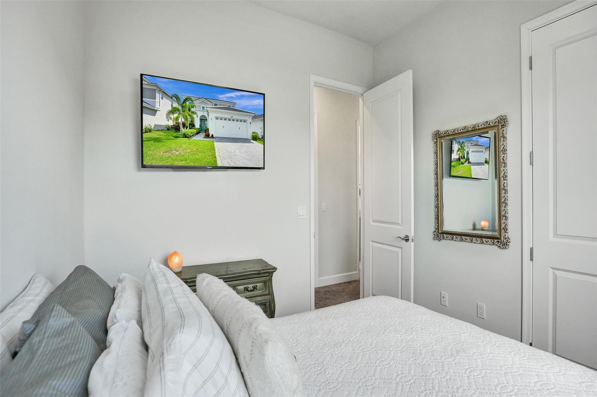 5416 Macoon Way Loxahatchee, FL 33470 - Photo 16 of 43 a bedroom with a bed and painting on the wall