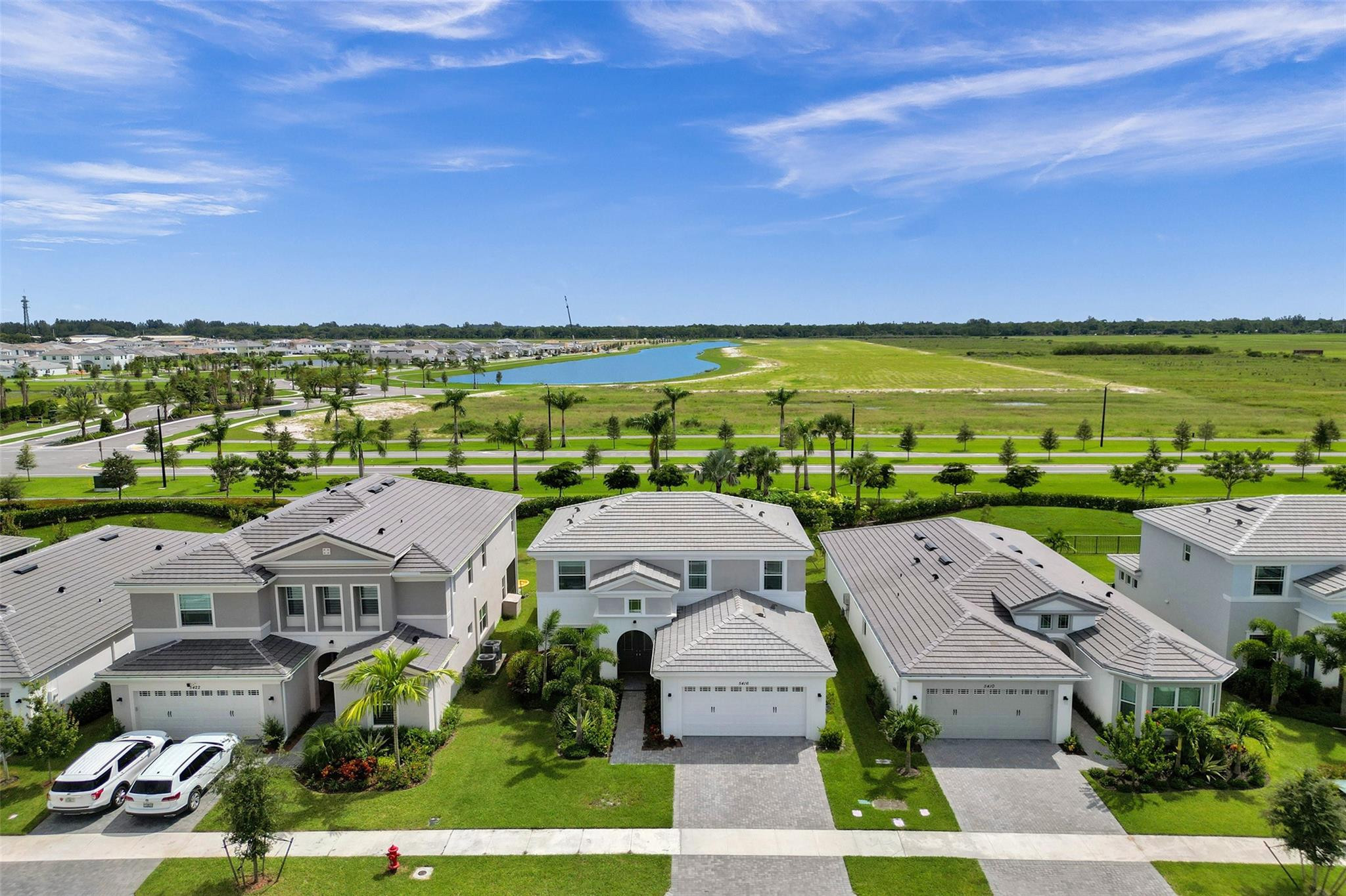 5416 Macoon Way Loxahatchee, FL 33470 - Photo 2 of 43 an aerial view of a house with a garden