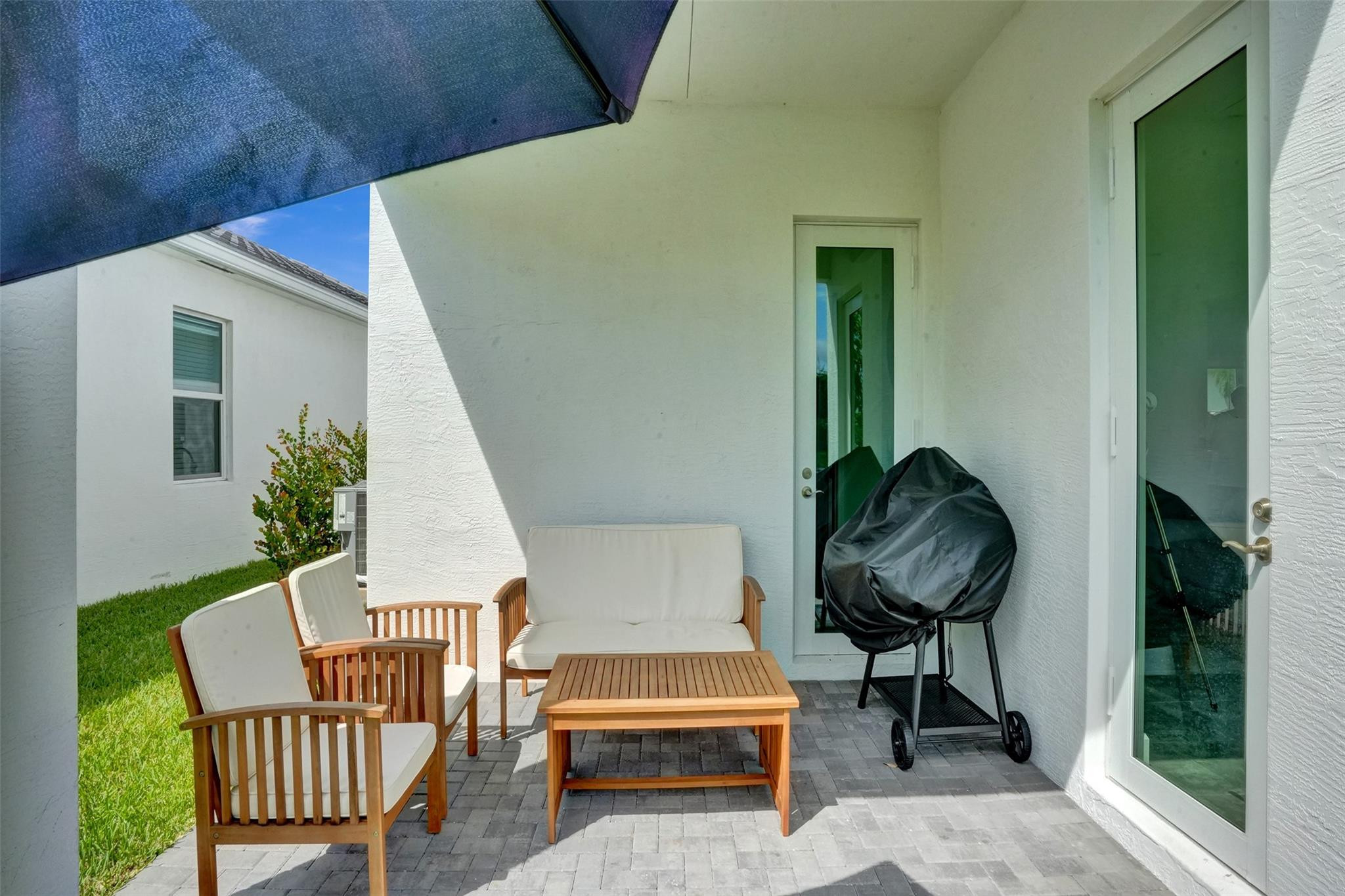 5416 Macoon Way Loxahatchee, FL 33470 - Photo 22 of 43 a balcony with furniture and a potted plant