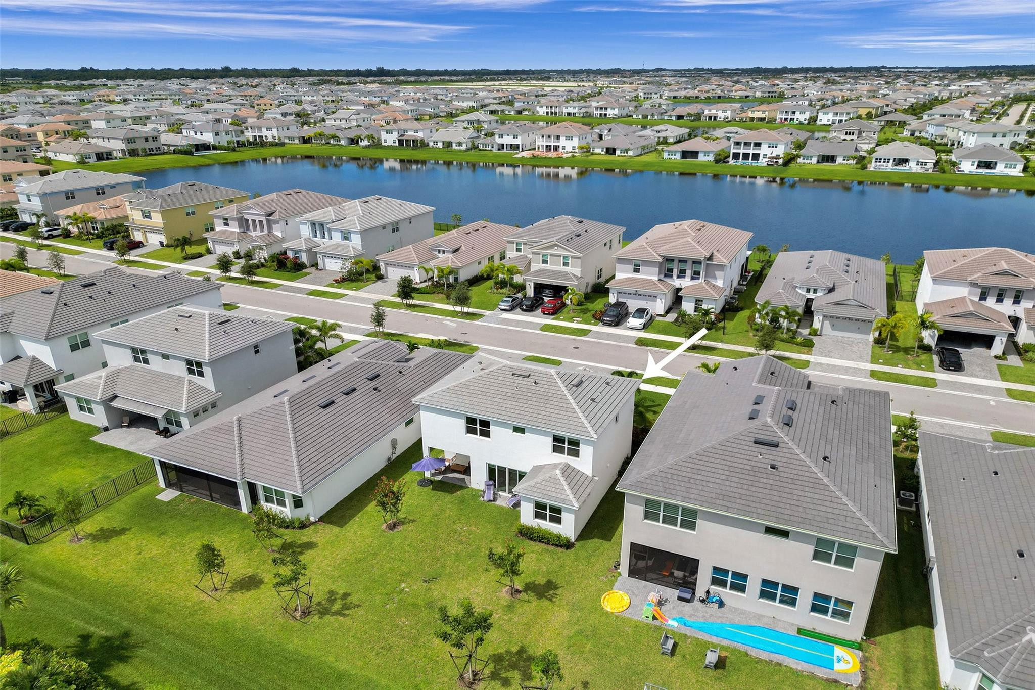 5416 Macoon Way Loxahatchee, FL 33470 - Photo 25 of 43 an aerial view of a house with a swimming pool