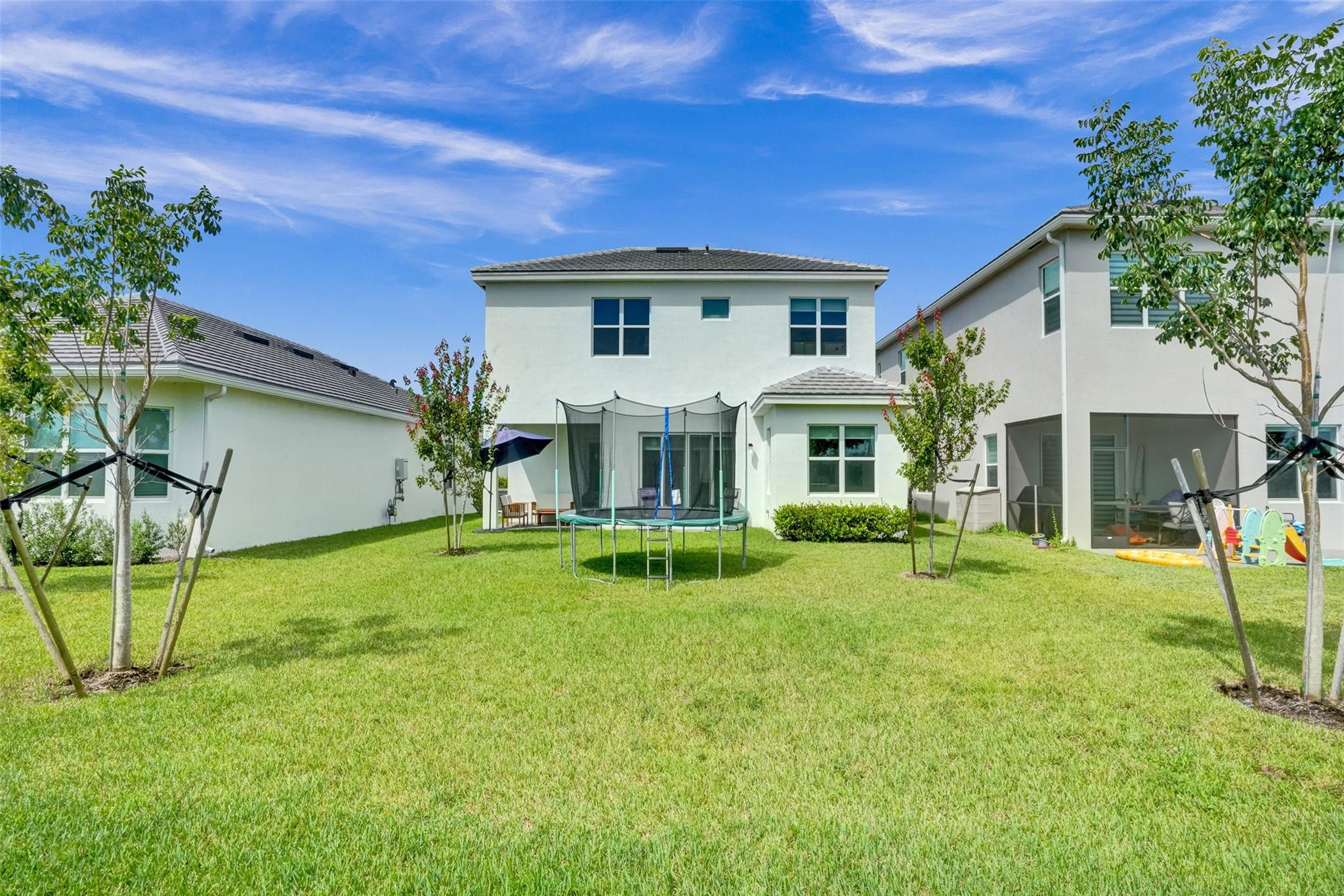 5416 Macoon Way Loxahatchee, FL 33470 - Photo 4 of 43 a view of house with backyard and deck