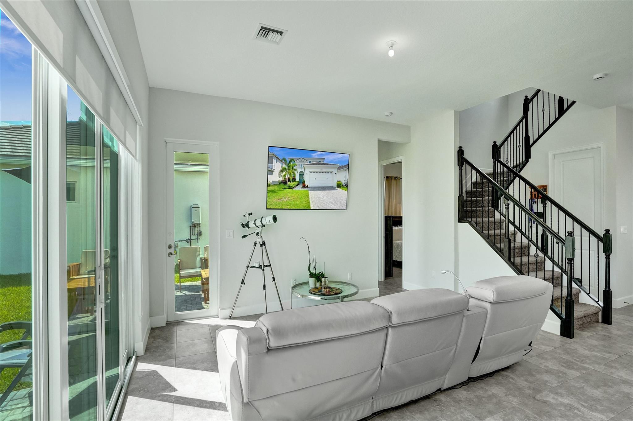 5416 Macoon Way Loxahatchee, FL 33470 - Photo 8 of 43 a living room with furniture and a table